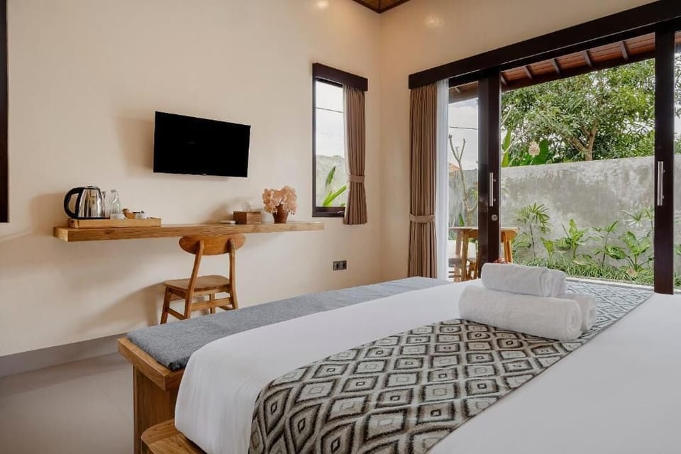 Deluxe Villa, 1 Bedroom, Balcony, Pool View | Minibar, in-room safe, desk, laptop workspace