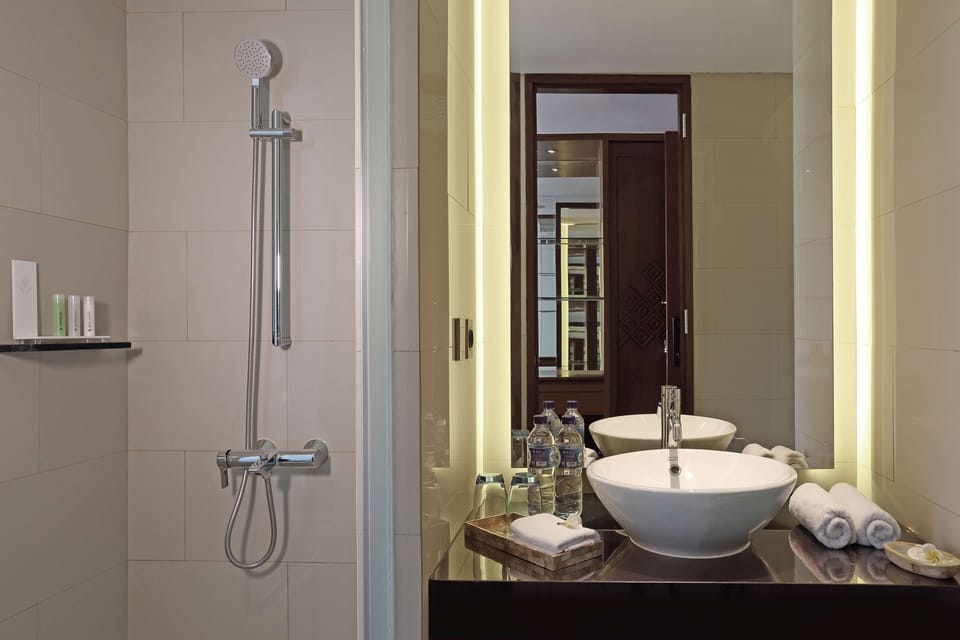Shower, eco-friendly toiletries, hair dryer, slippers