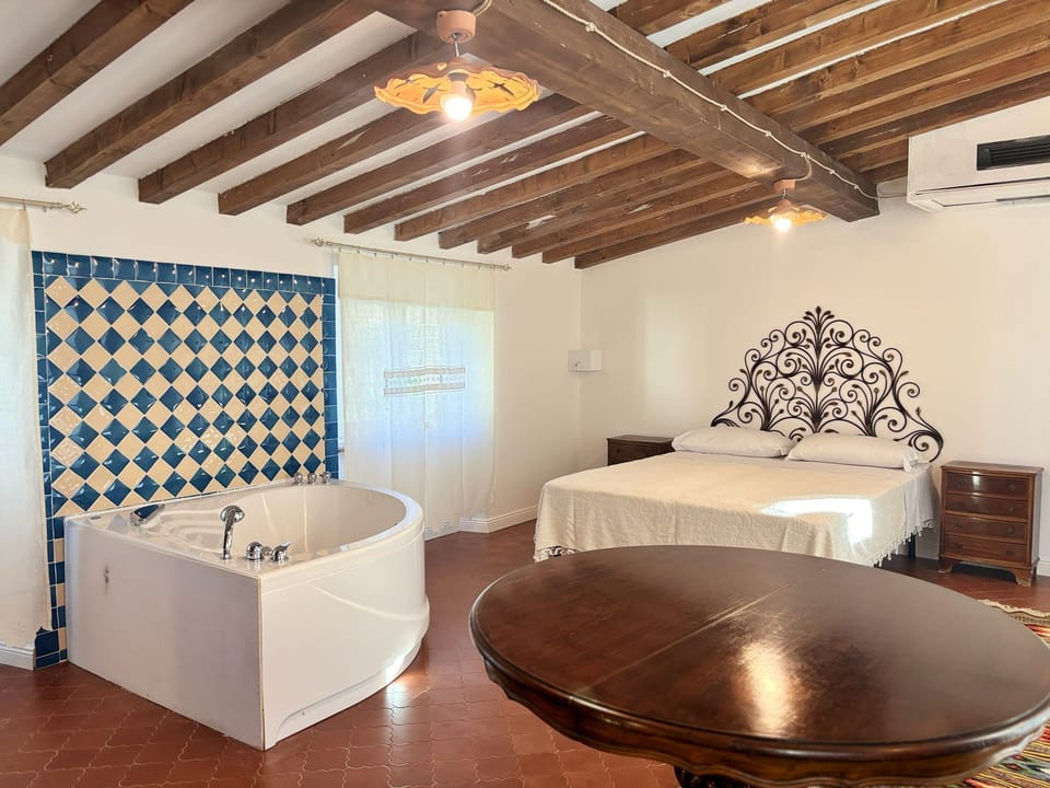 Superior Suite, Mountain View | Bathroom | Separate tub and shower, hair dryer, slippers, towels