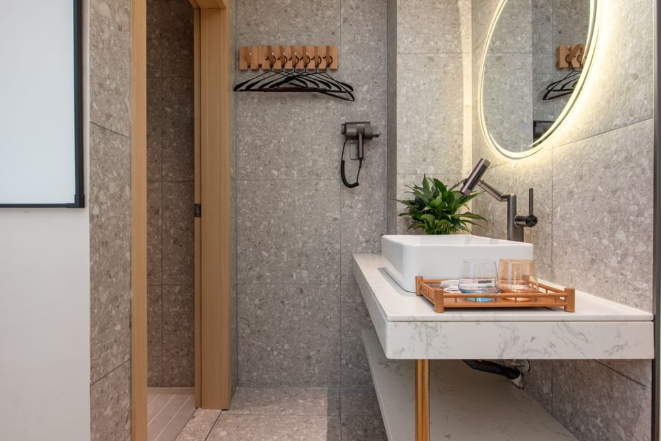 Signature Double Room, City View | Bathroom | Shower, hair dryer, slippers, towels