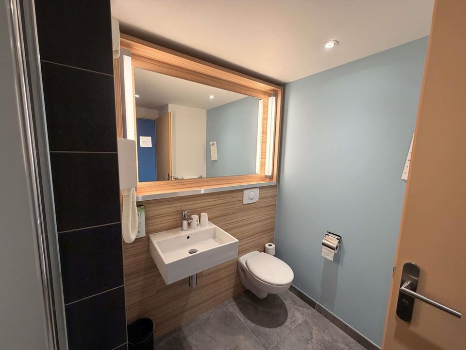 Premium bedding, desk, laptop workspace, blackout drapes