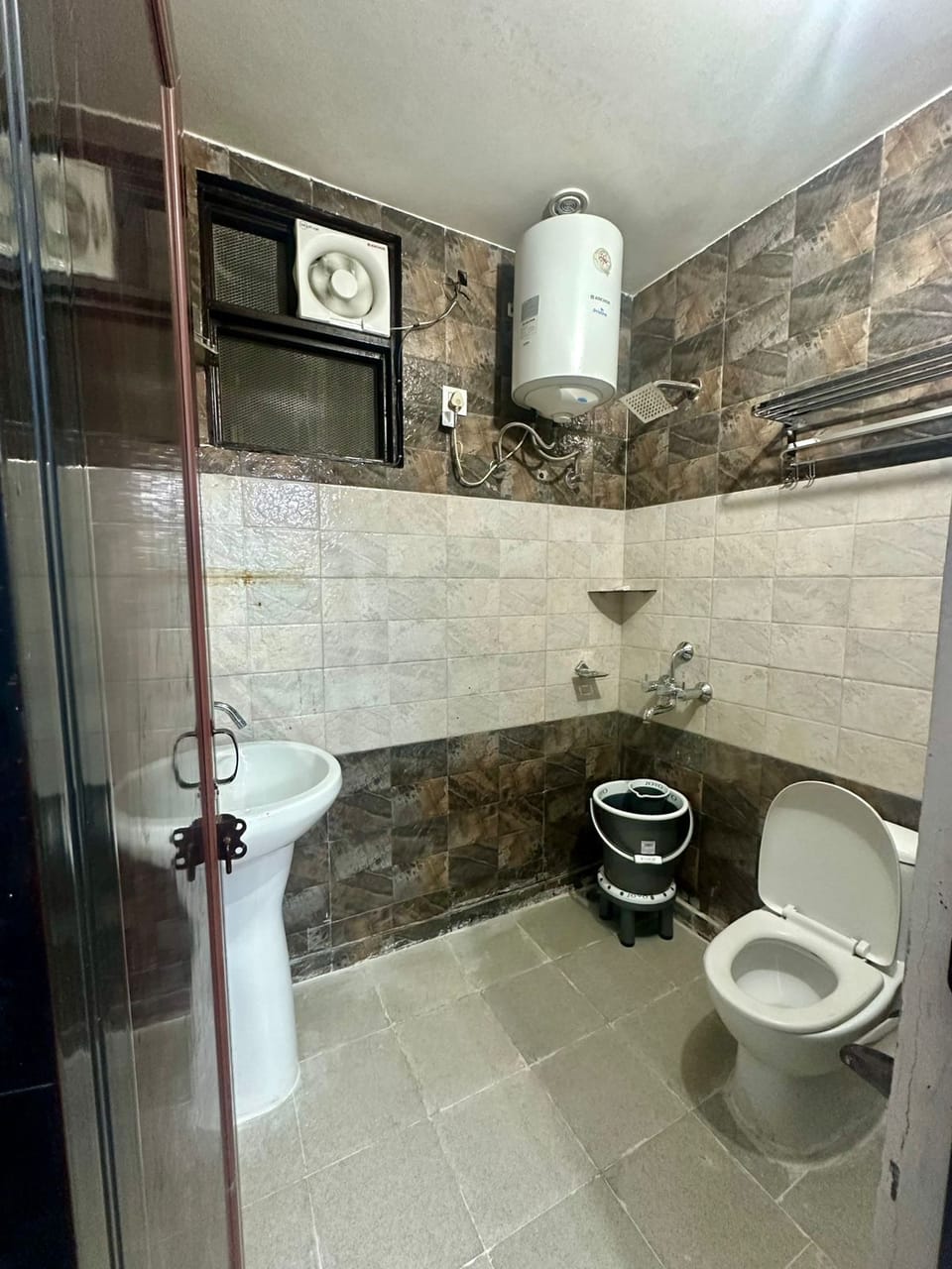 Shower, towels, soap, toilet paper
