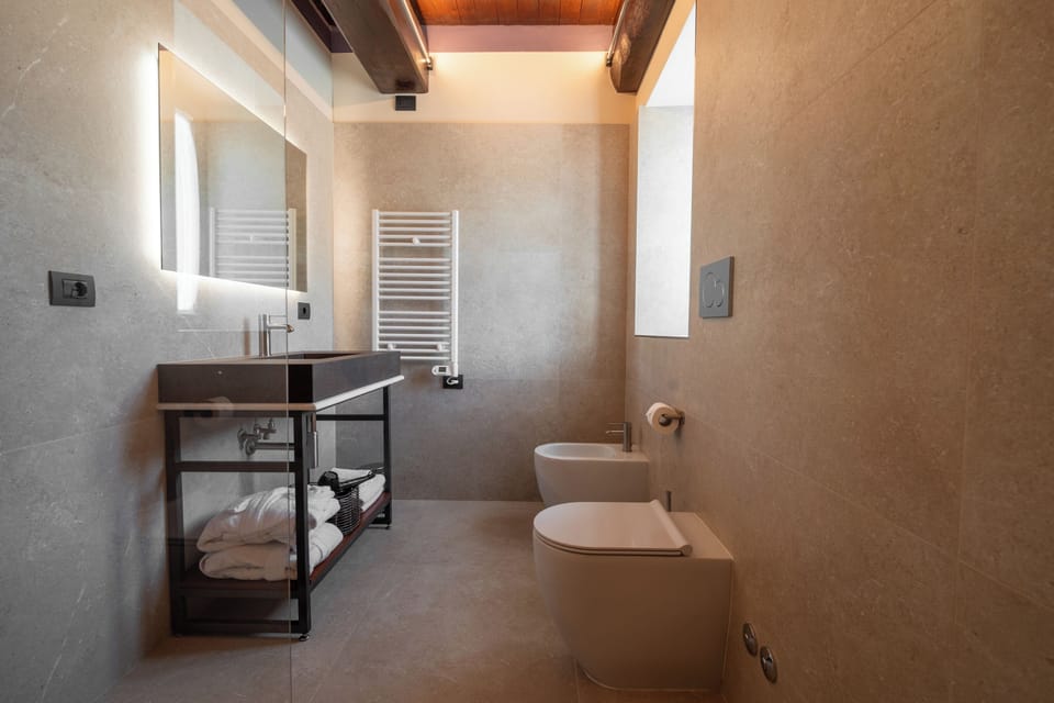Shower, hair dryer, slippers, towels