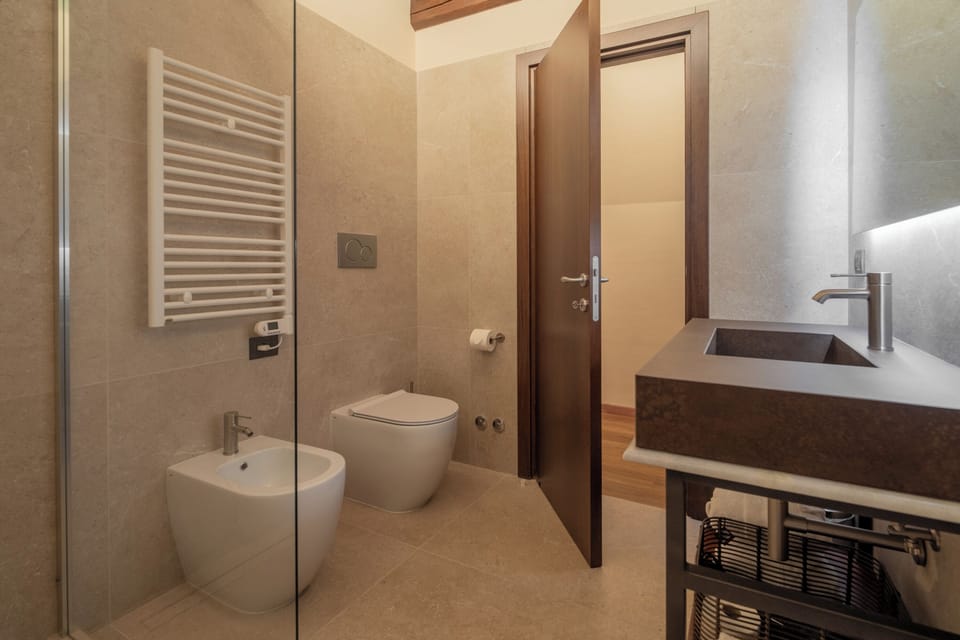 Shower, hair dryer, slippers, towels