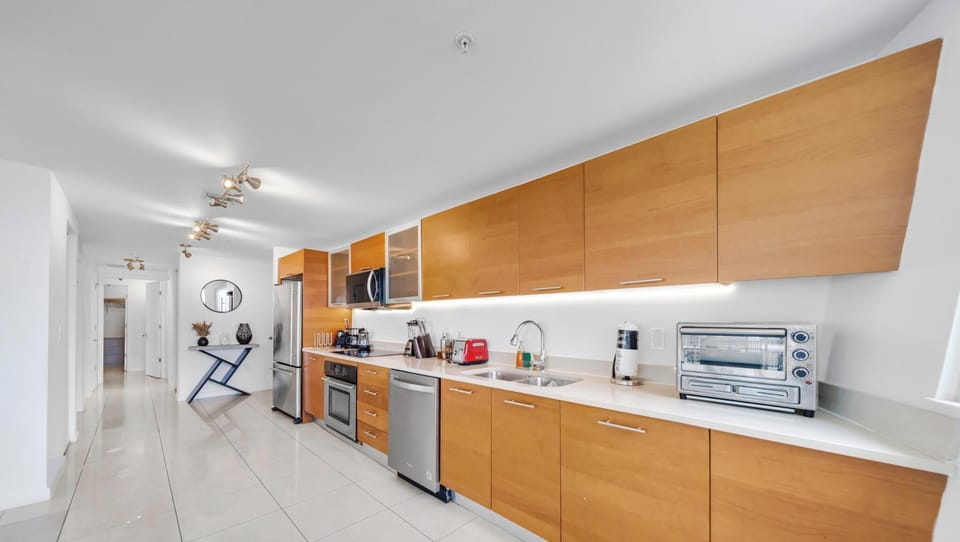 Condo, Balcony, City View | Private kitchen | Espresso maker, fridge, microwave, dishwasher