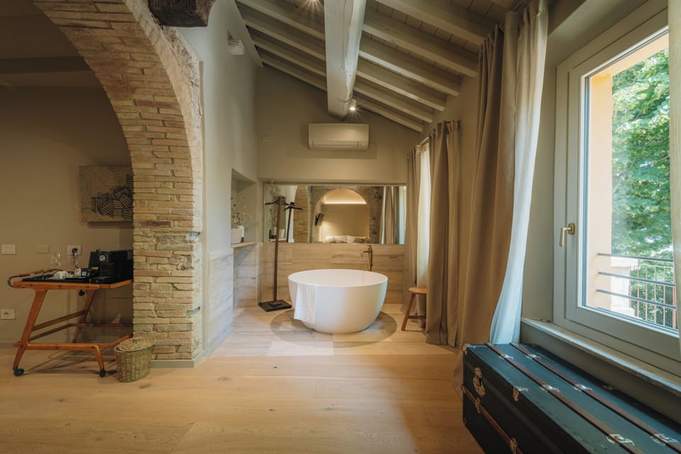 Junior Suite, Garden View | In-room safe, desk, soundproofing, iron/ironing board