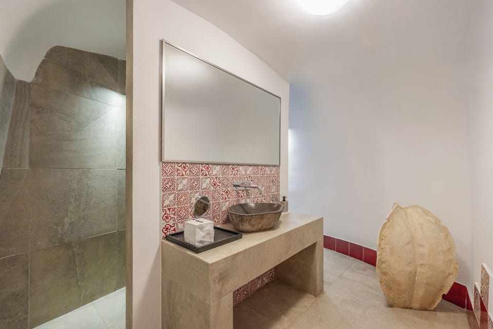 The Core Suite | Bathroom | Hair dryer, slippers, towels, soap