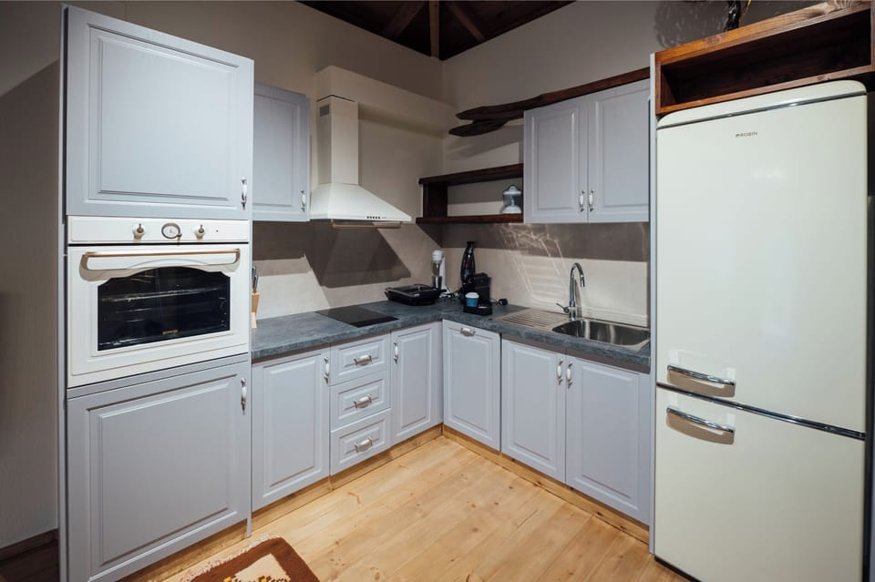 Superior Suite | Private kitchen | Coffee/tea maker, full-size fridge, oven, stovetop