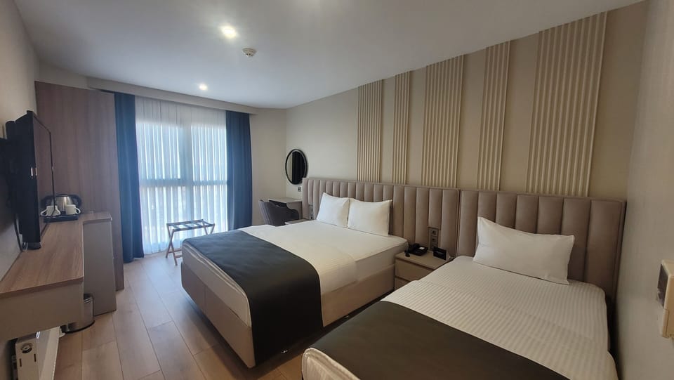 Family Twin Room, Sea View | In-room safe, blackout drapes, iron/ironing board (on request)