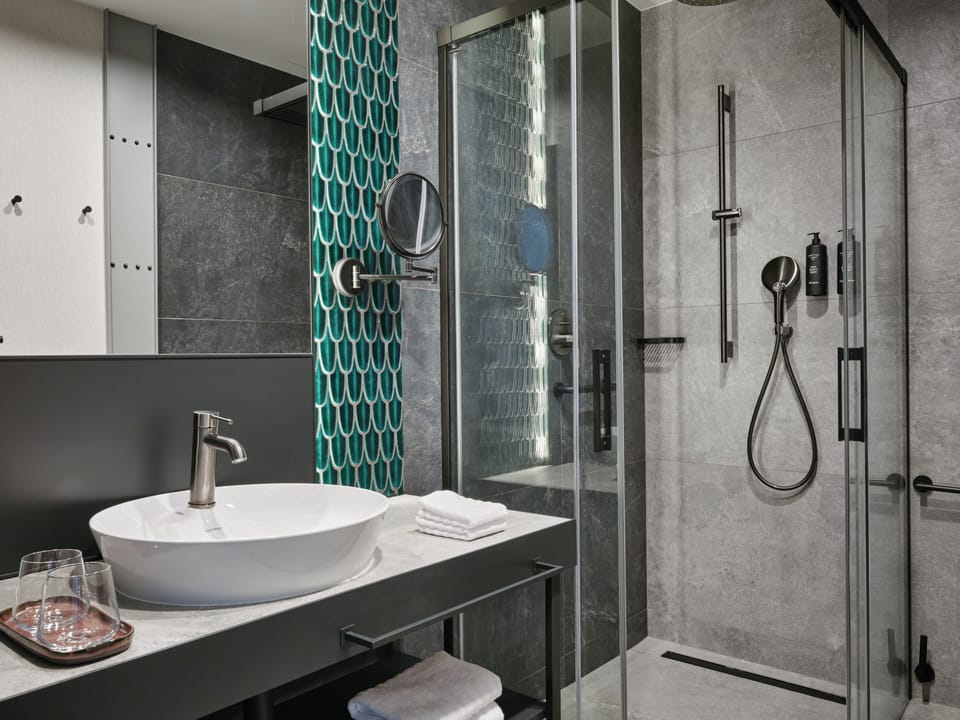 Shower, rainfall showerhead, hair dryer, towels