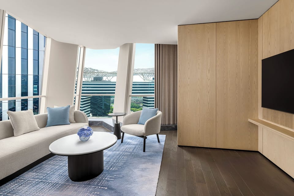 Executive Suite, 1 King Bed | Living area | 42-inch flat-screen TV with cable channels