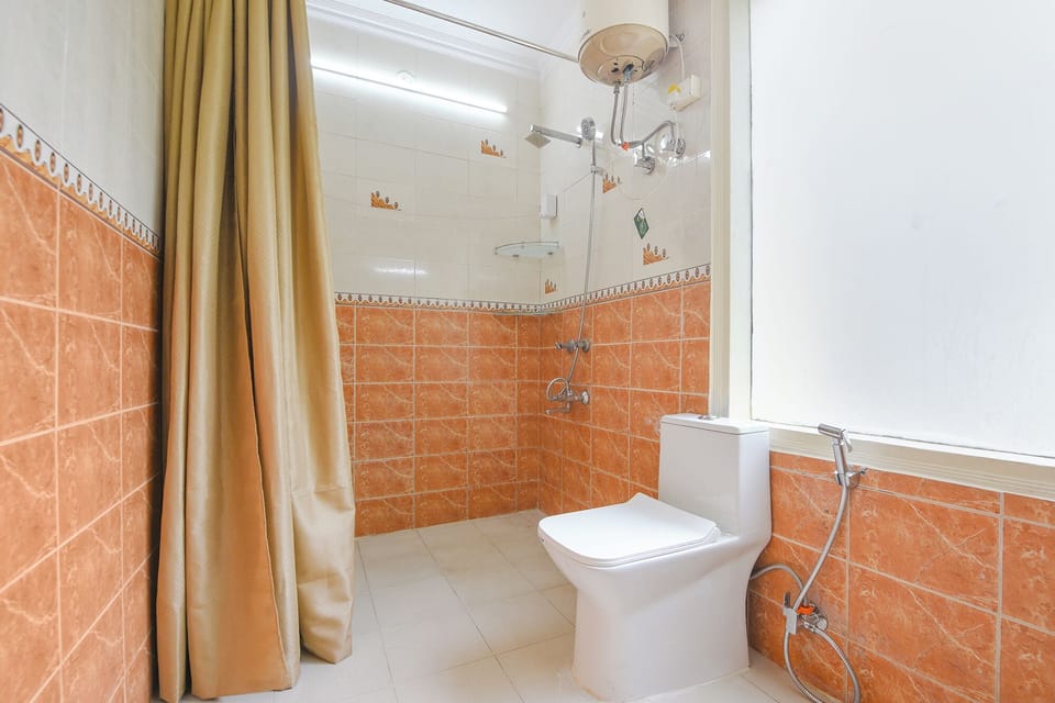 Shower, rainfall showerhead, towels, toilet paper