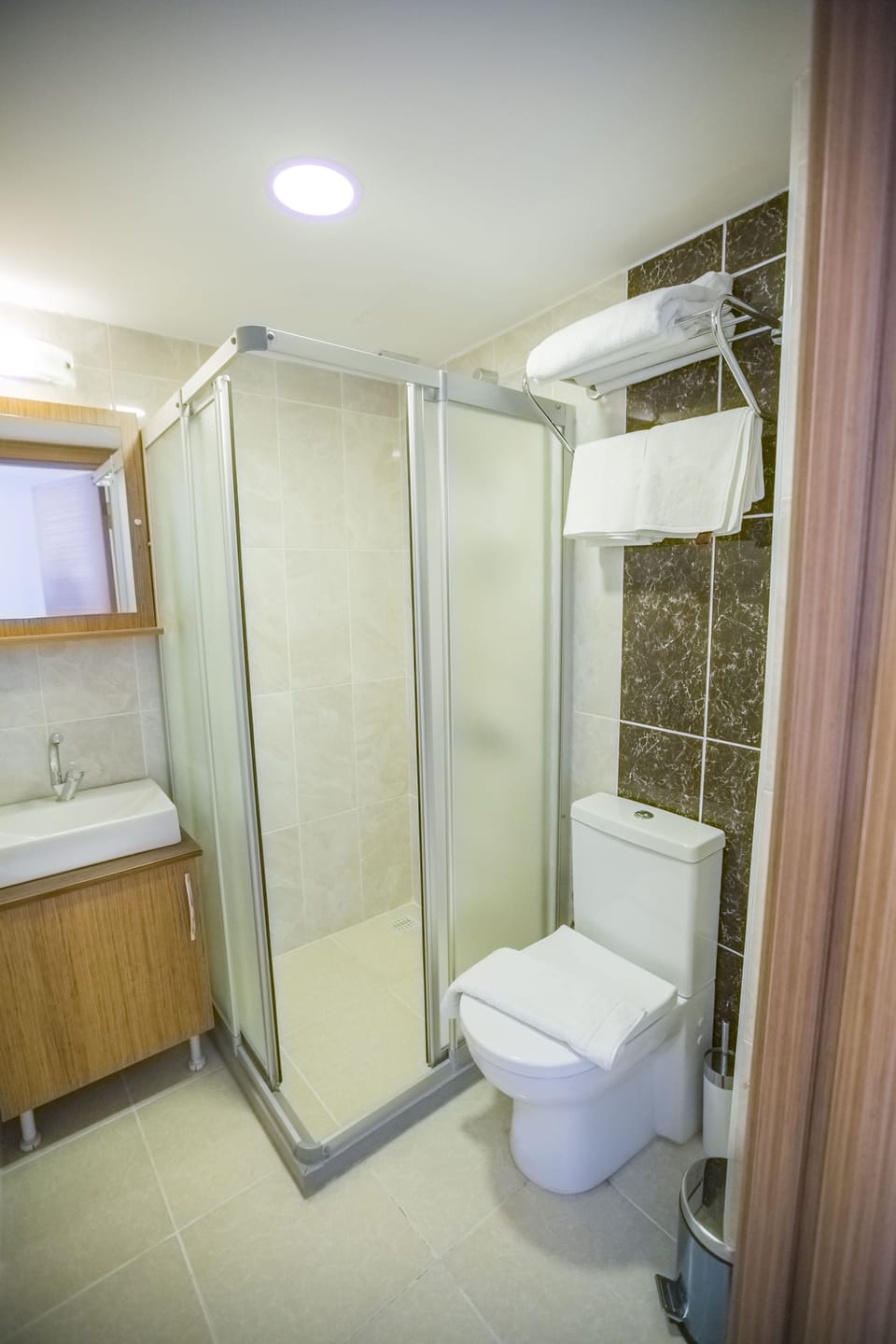 Shower, free toiletries, hair dryer, slippers