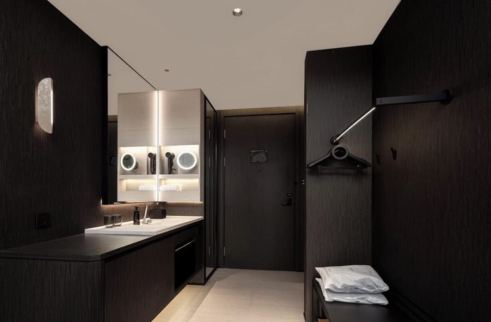 Shower, hair dryer, slippers, towels