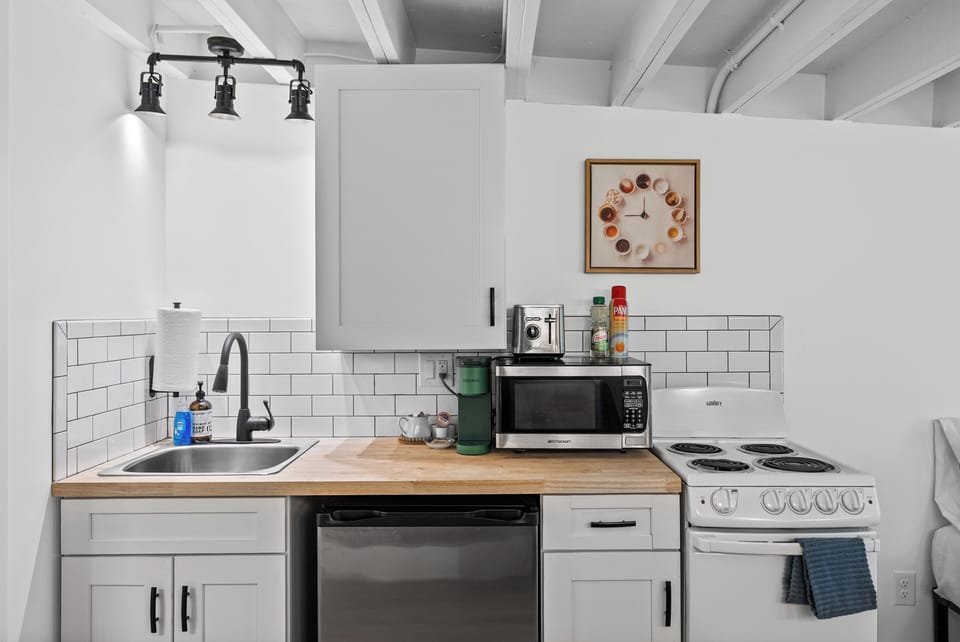 Apartment, 1 Queen Bed, Kitchen, Garden View (1BD (Plumb Line Coffee)) | Private kitchen | Dining table