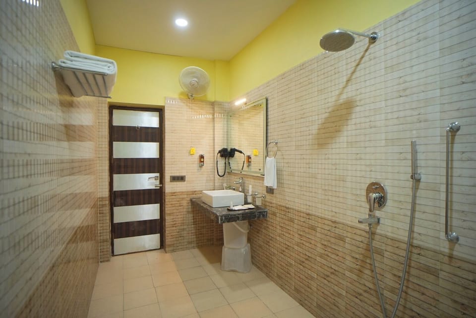 Standard Double Room | Bathroom | Shower, hair dryer, towels, soap