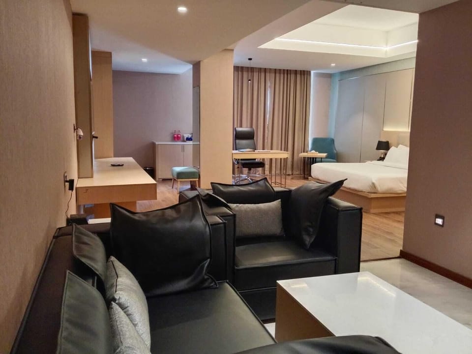 Luxury Suite, City View | In-room safe, desk, laptop workspace, blackout drapes