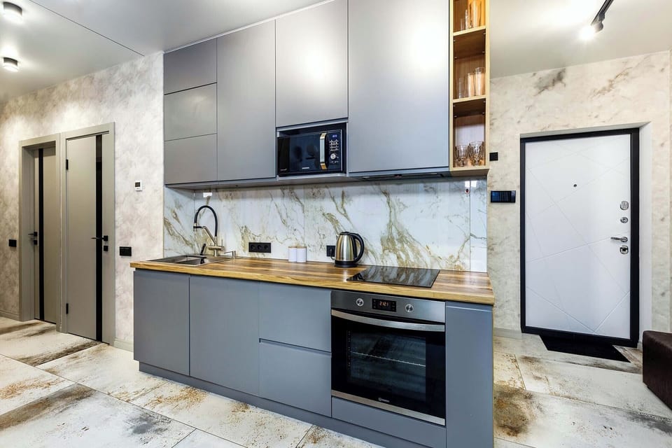 Luxury Apartment, Balcony, City View | Private kitchen | Electric kettle, griddle, cleaning supplies, freezer