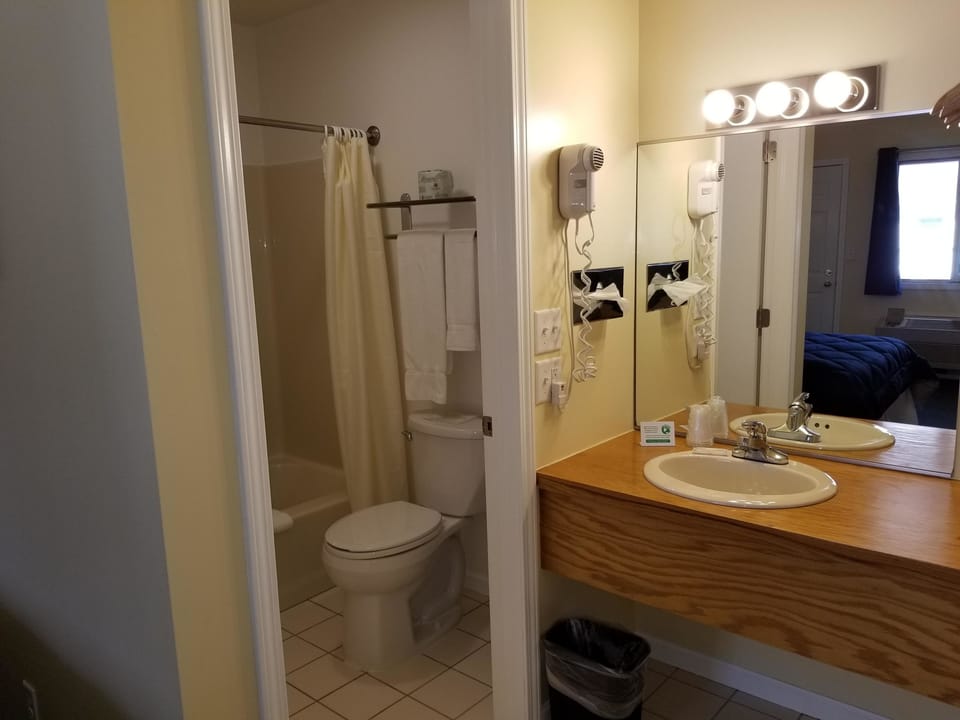 Room, 1 Queen Bed | Bathroom | Combined shower/tub, hair dryer, towels, soap