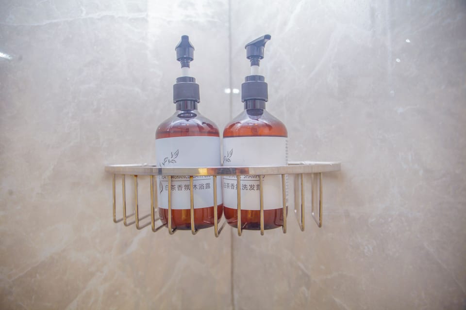 Combined shower/tub, towels, soap, shampoo
