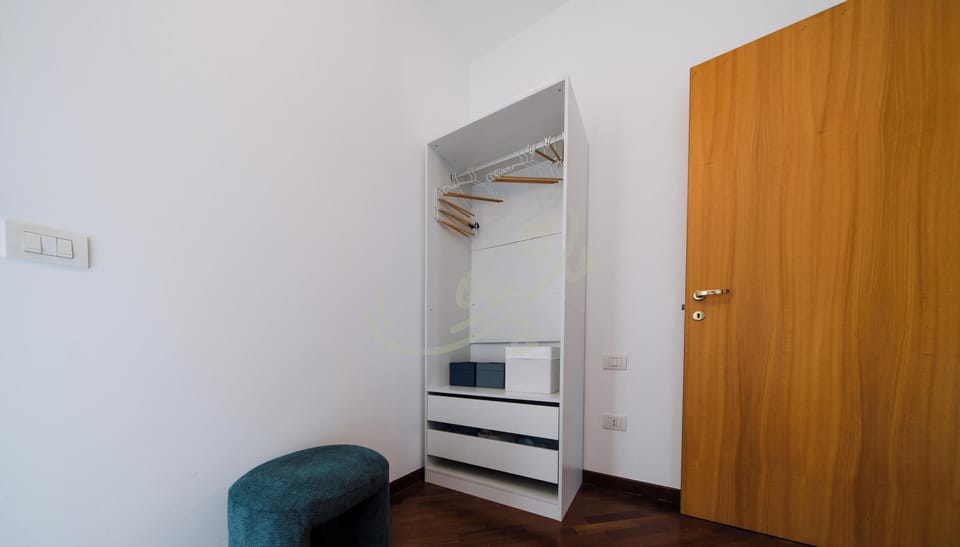 Apartment (2 Bedrooms) | Iron/ironing board, bed sheets