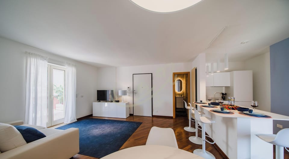 Apartment (2 Bedrooms) | Living area | 32-inch Smart TV with cable channels