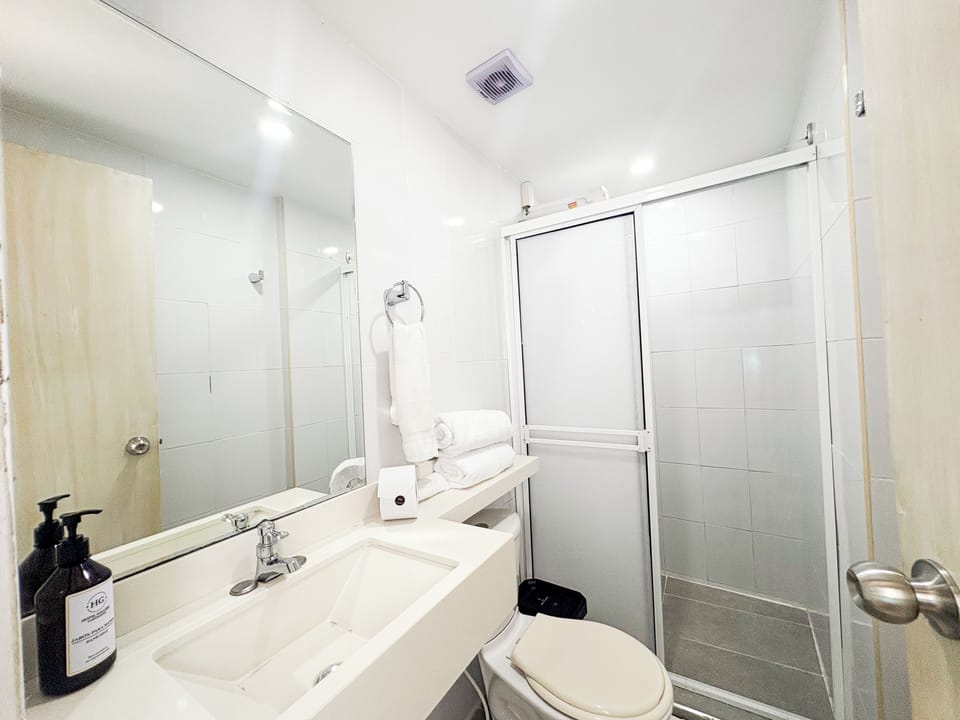 Basic Double Room, 1 Queen Bed, Private Bathroom | Bathroom | Shower, towels, soap, shampoo
