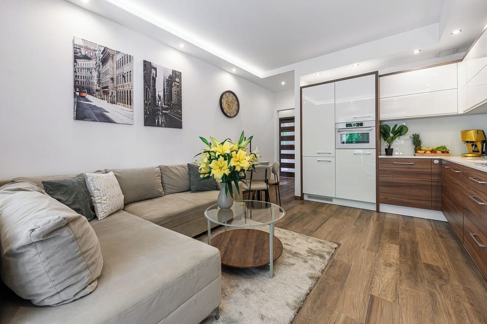 Deluxe Apartment, 2 Bedrooms, Courtyard View | Living area | 36-inch flat-screen TV with satellite channels