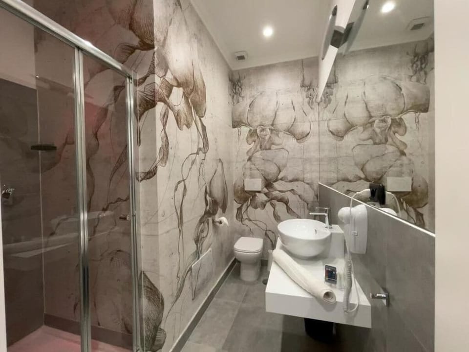 Shower, hair dryer, slippers, towels