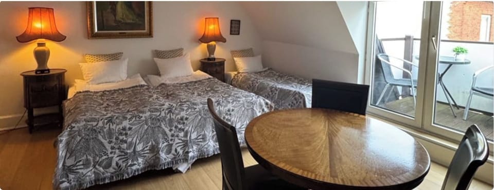 Triple Room, Balcony, City View | Individually furnished, bed sheets