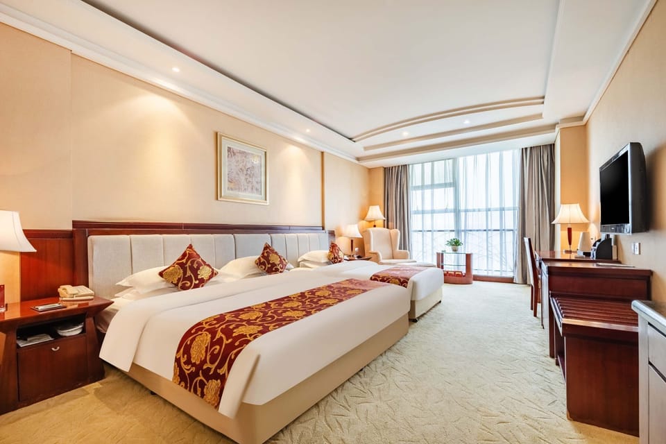 Family Twin Room, City View | Minibar, desk, laptop workspace, blackout drapes