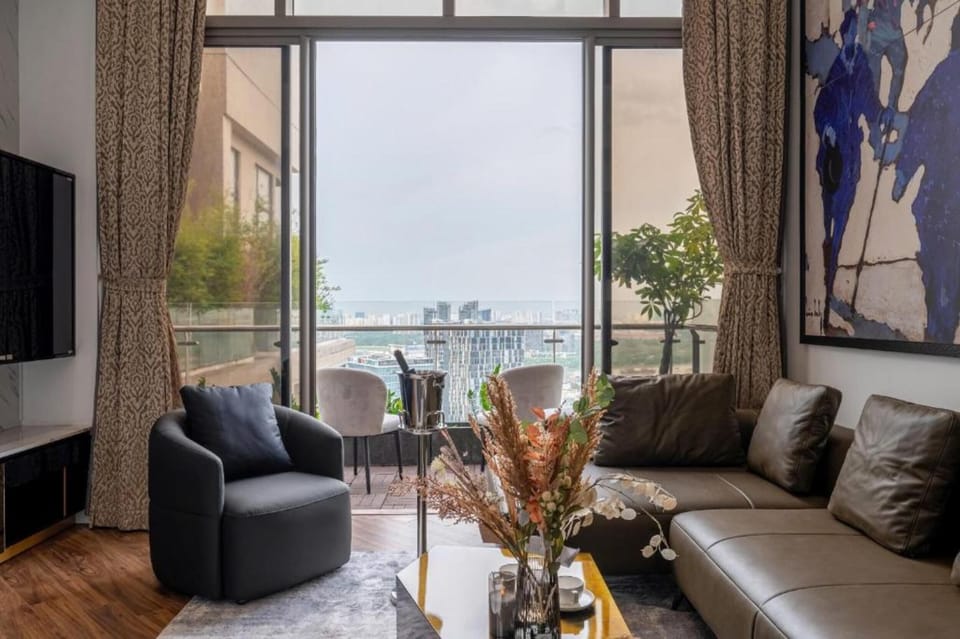 Apartment, Balcony, City View | Living area | 60-cm flat-screen TV with satellite channels