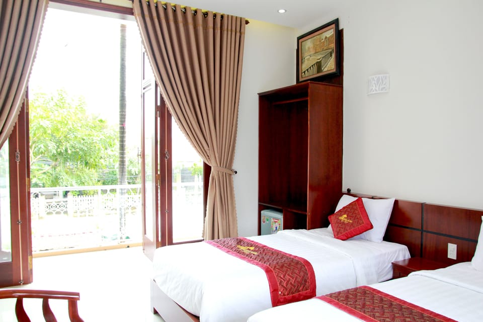 Deluxe Triple Room, Balcony | Minibar, in-room safe, desk, soundproofing