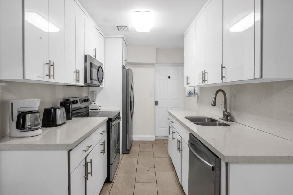 Comfort Townhome, Patio, Courtyard View | Private kitchen | Shared fridge, shared microwave, highchair