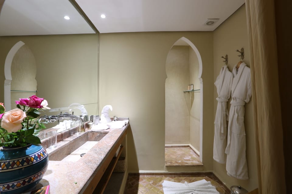 Elite Room | Bathroom | Shower, rainfall showerhead, designer toiletries, hair dryer