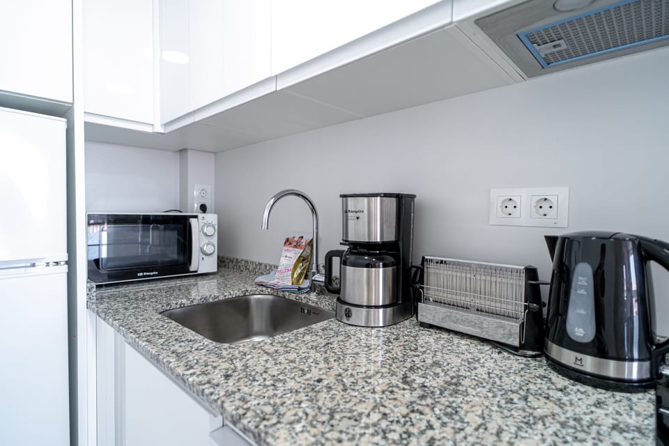 Coffee/tea maker, microwave, dishwasher, cookware/dishes/utensils