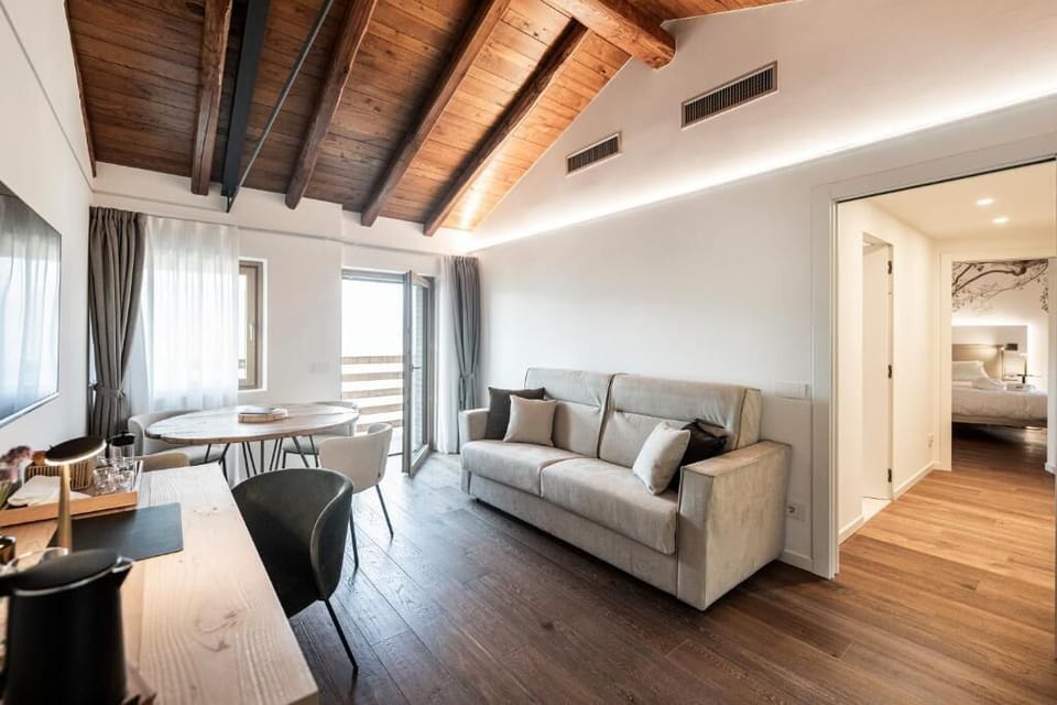 Deluxe Suite, Balcony, Mountain View | Living area | 40-inch Smart TV with cable channels