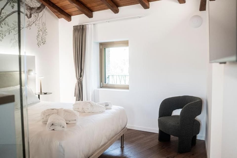 Deluxe Suite, Balcony, Mountain View | Minibar (free items), in-room safe, desk, laptop workspace