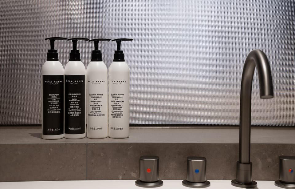 Separate tub and shower, hair dryer, towels, shampoo
