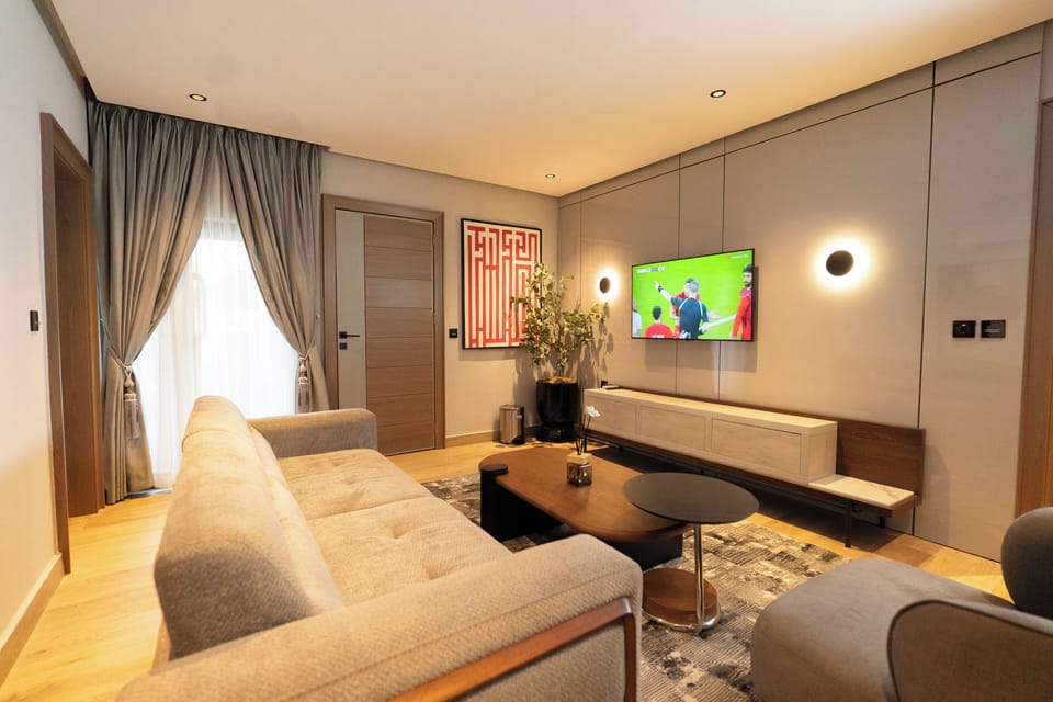 Economy Suite, Balcony, Pool View | Living area | 55-inch Smart TV with satellite channels