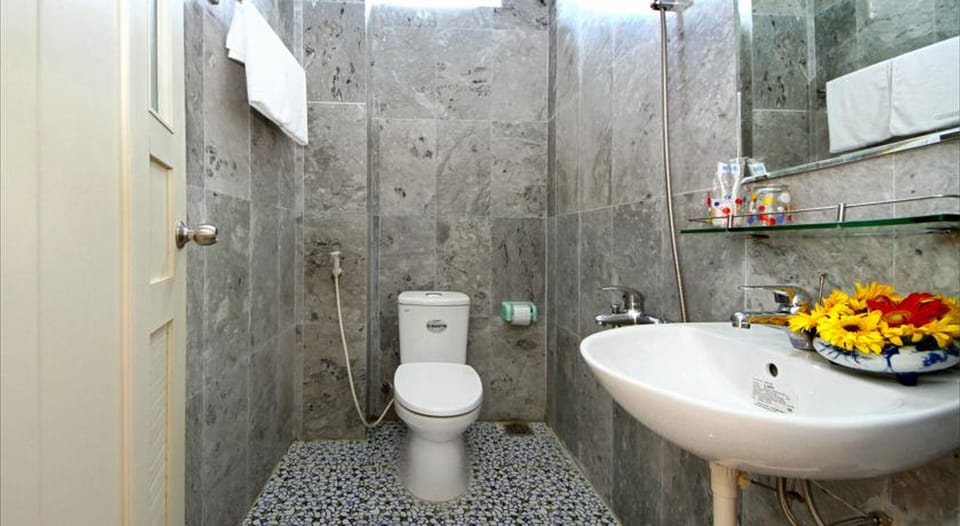 Shower, free toiletries, hair dryer, slippers