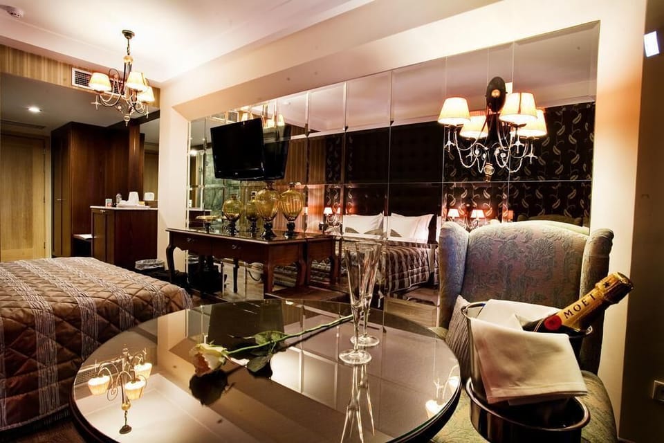 Junior Suite, Pool View | In-room safe, desk, laptop workspace, soundproofing