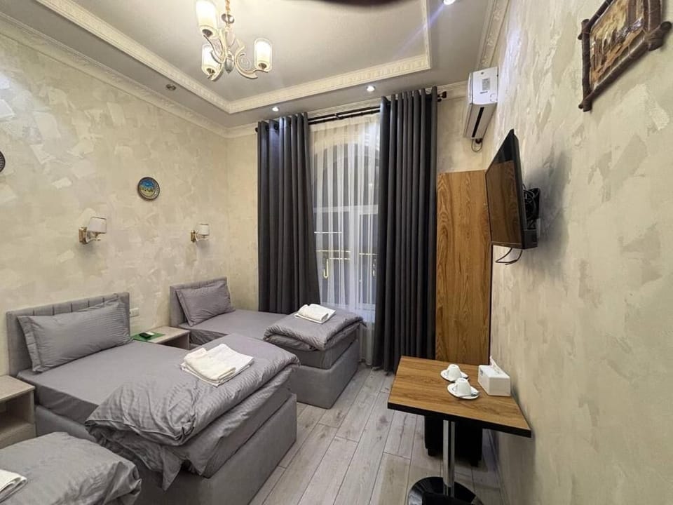 Standard Triple Room, City View | Desk, laptop workspace, soundproofing, WiFi (free)