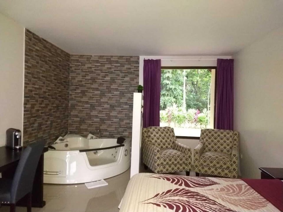Suite | Living area | 21-inch LCD TV with cable channels, TV