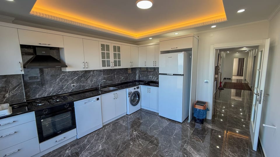 Apartment, Sea View | Private kitchen | Full-size fridge, microwave, oven, stovetop