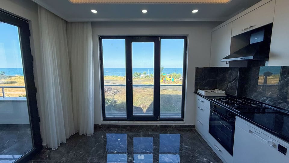 Apartment, Sea View | Private kitchen | Full-size fridge, microwave, oven, stovetop