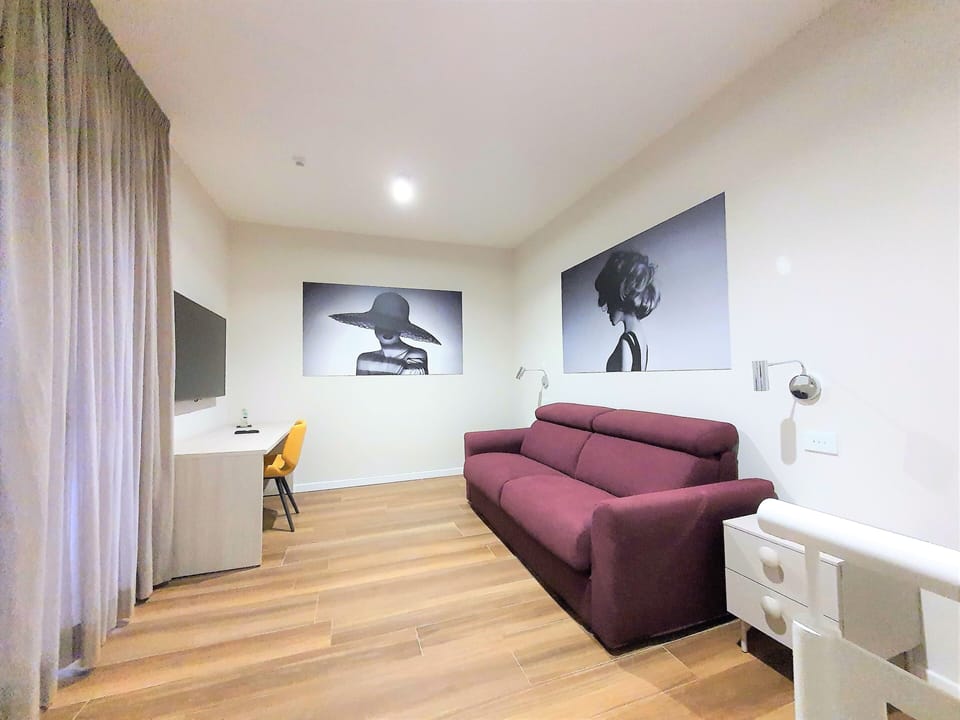 Family Apartment, Balcony | Living area | Fireplace