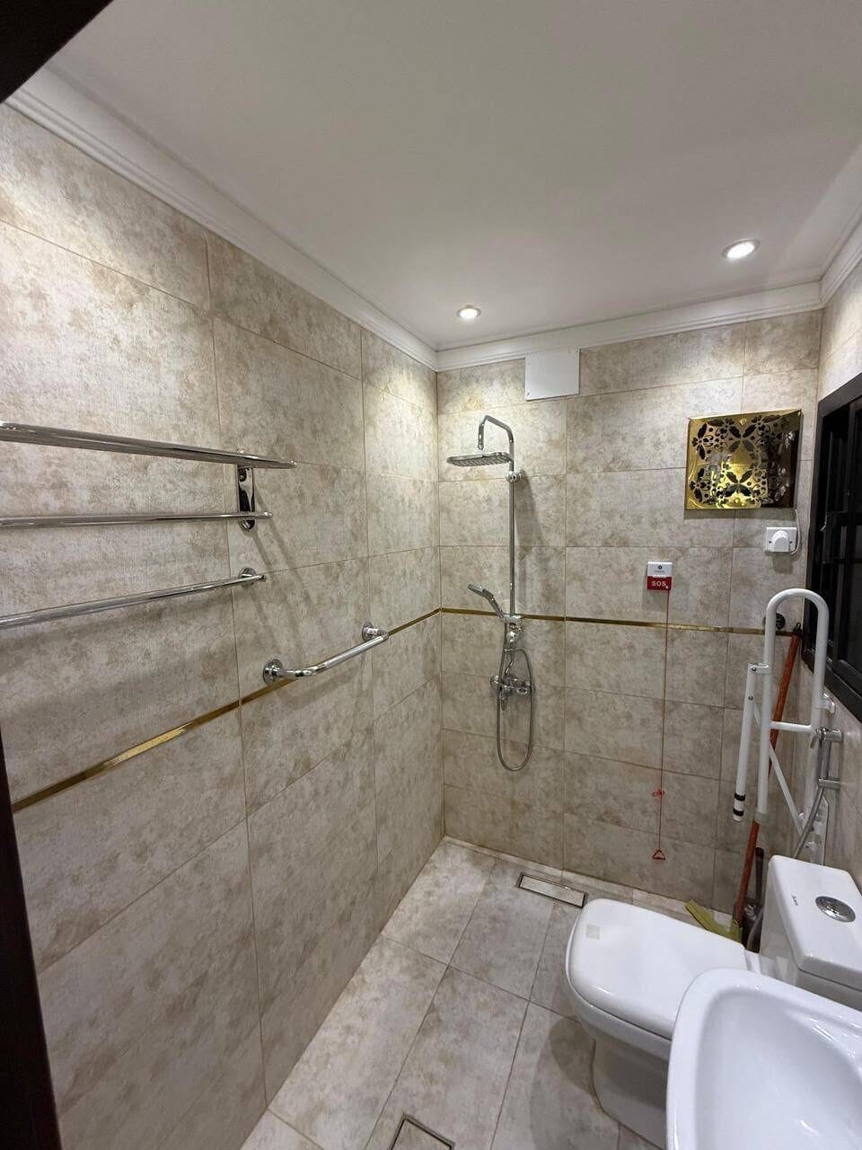 Shower, towels, soap, toilet paper
