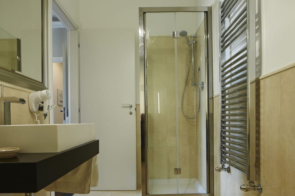 Panoramic Triple Room, Ocean View | Bathroom | Shower, rainfall showerhead, free toiletries, bathrobes