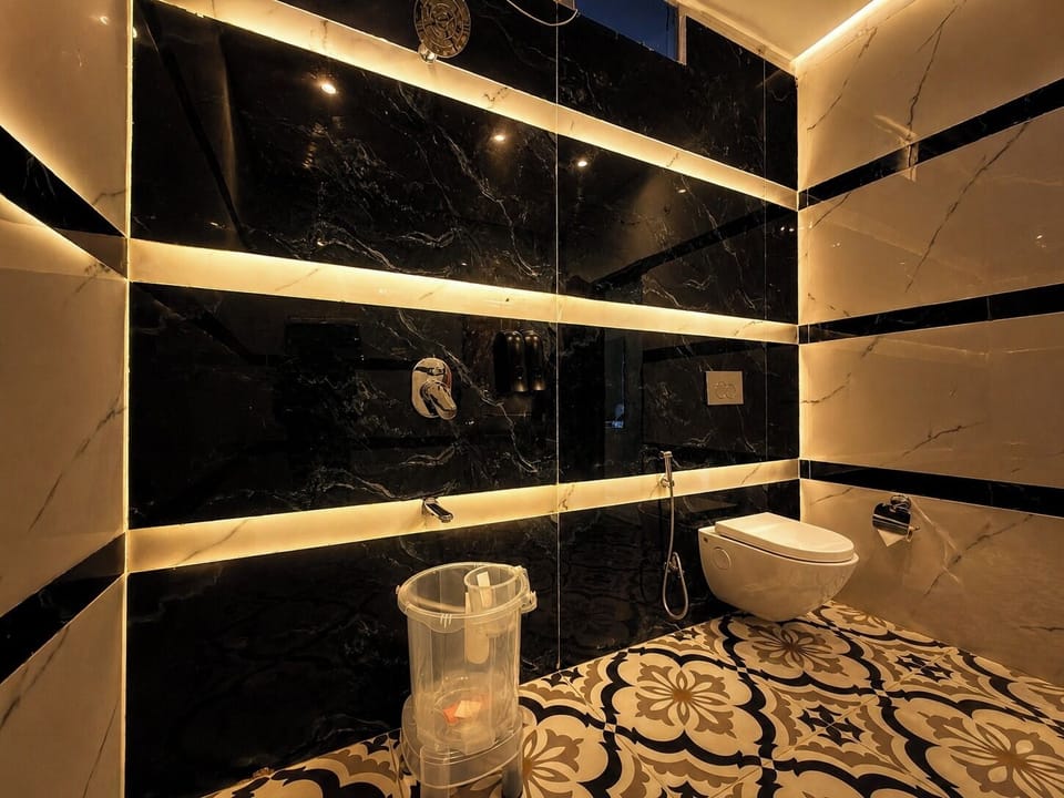 Luxury Studio Suite, Balcony | Bathroom | Shower, hair dryer, slippers, towels